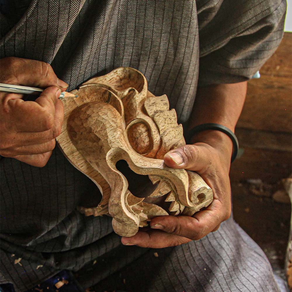 A mask maker at Khengkhar