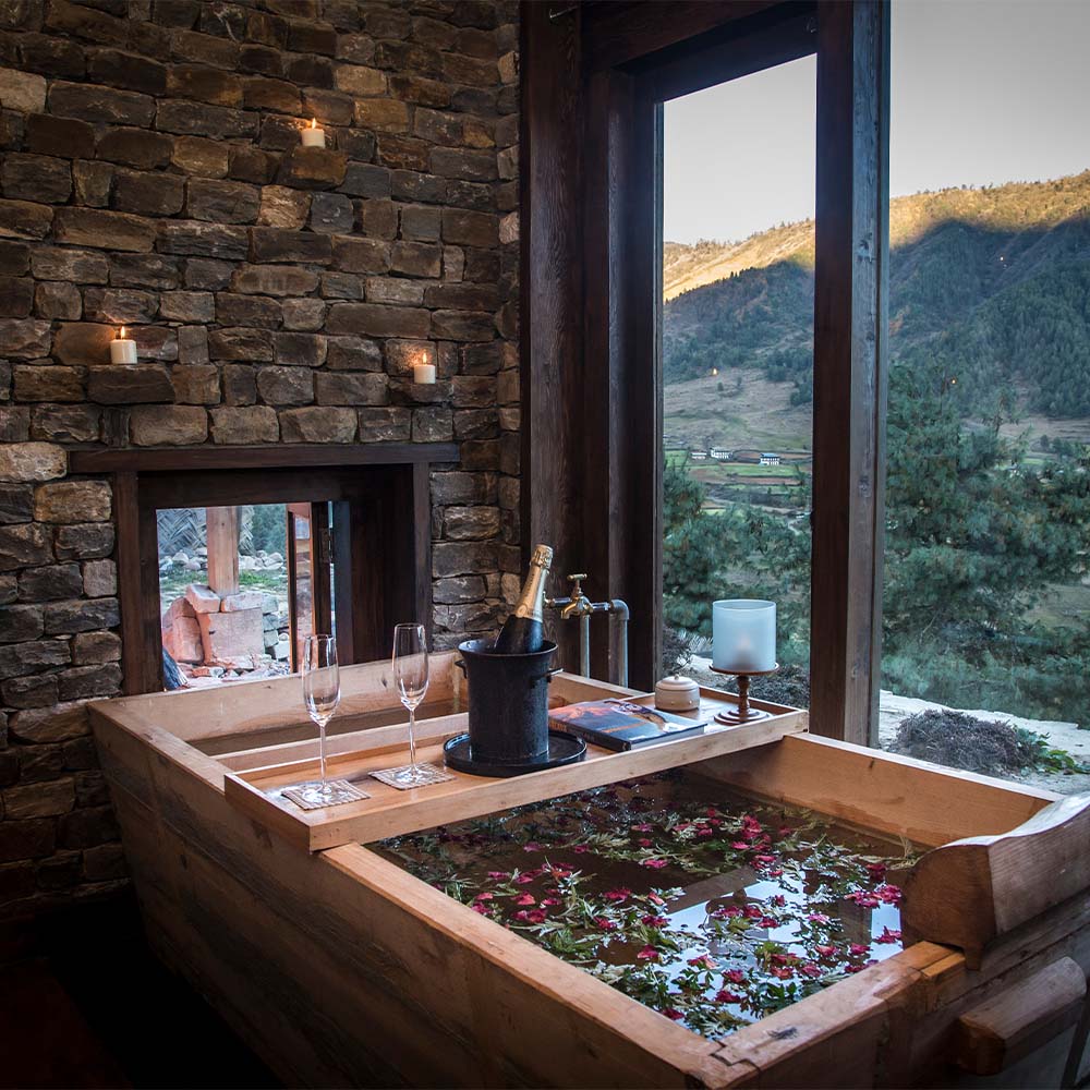 A traditional hot stone bath at a Wangdue lodge