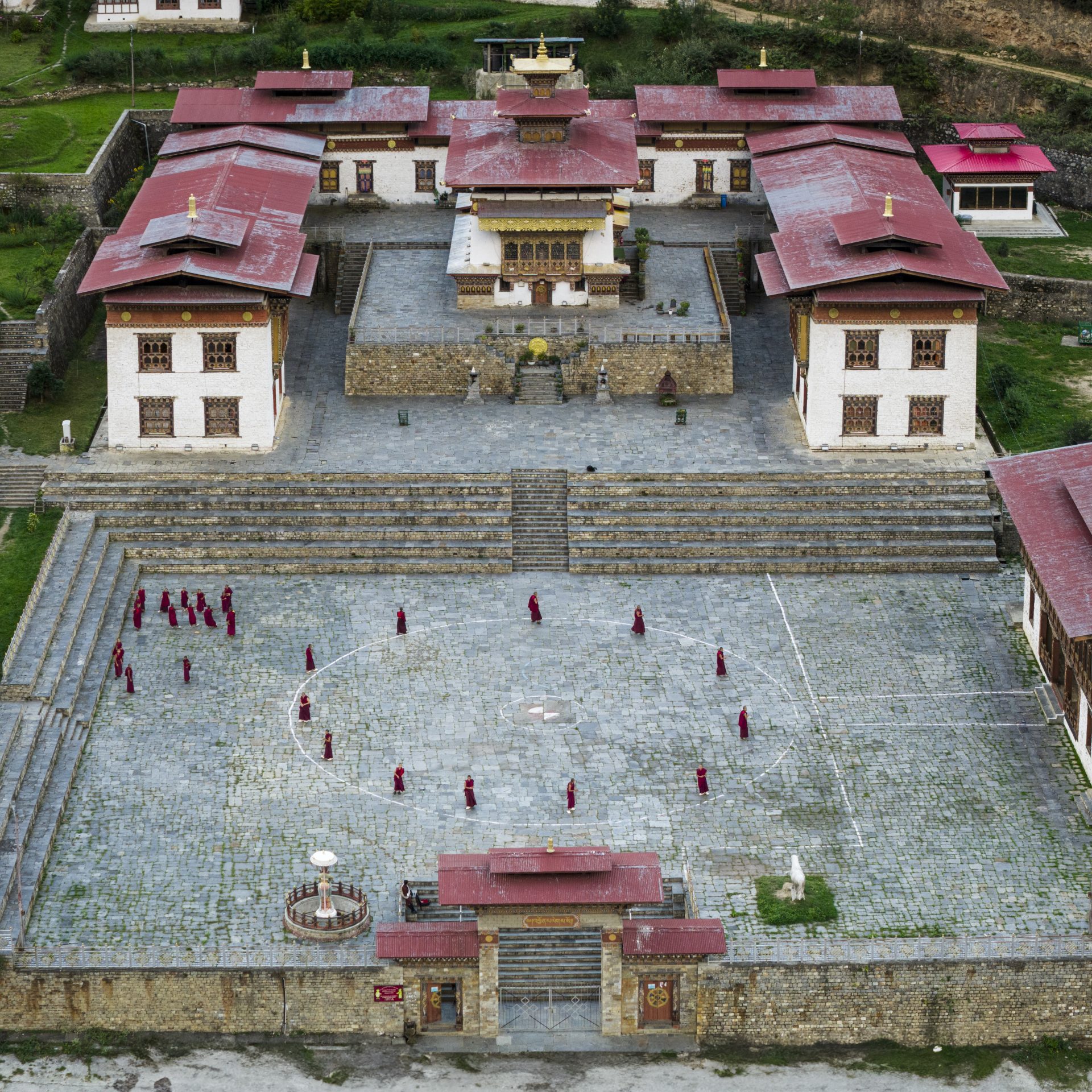 Monks in the courtyard of Lhakhang Karpo in Haa