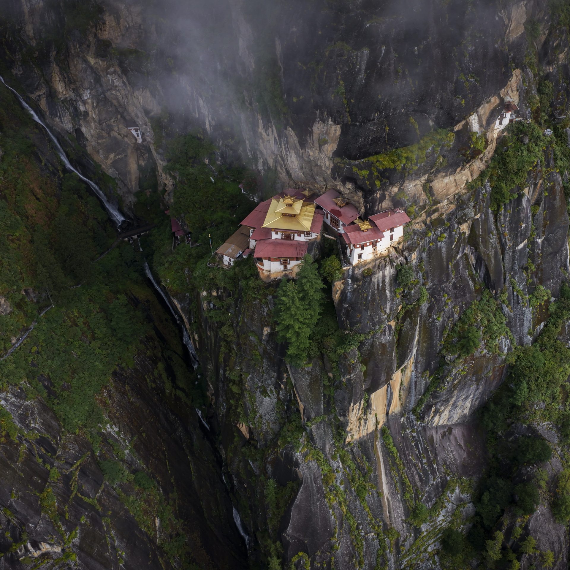 Taktshang, the Tiger's Nest, on its cliff face from the air