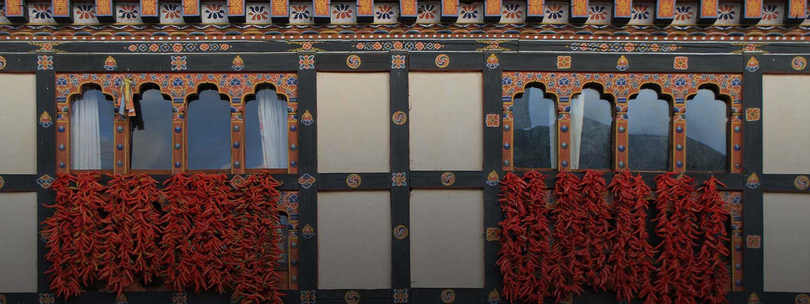 Chillies drying on a traditional Bhutanese window