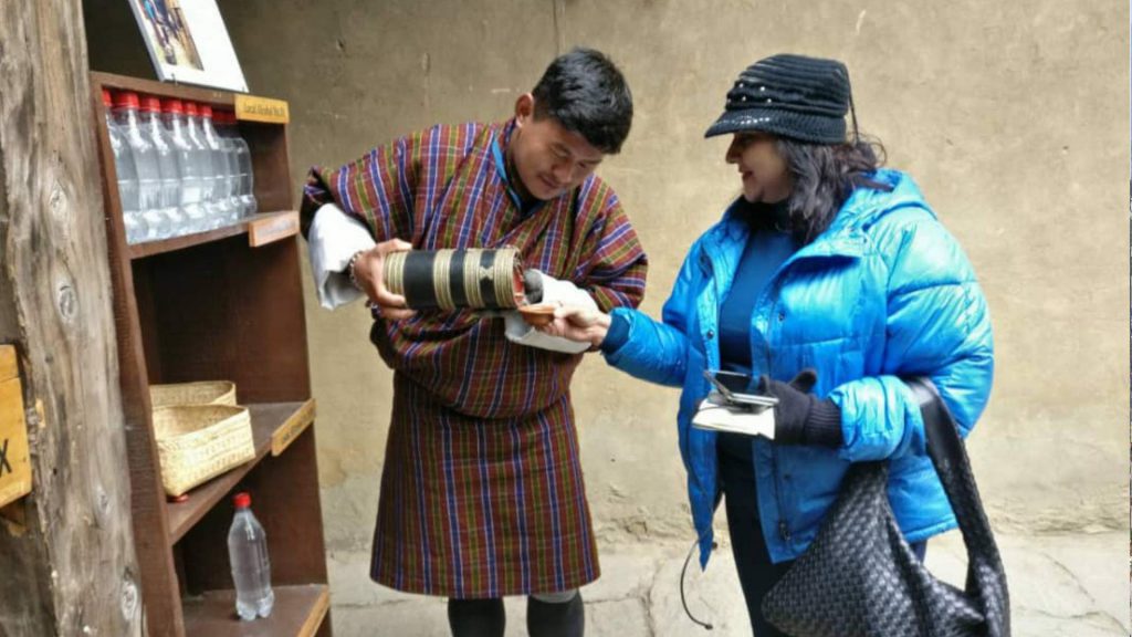 A guest meeting a local host in a Bhutanese village