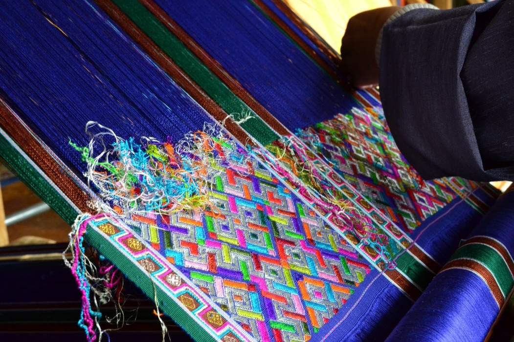 A part-woven kira on a Bhutanese loom