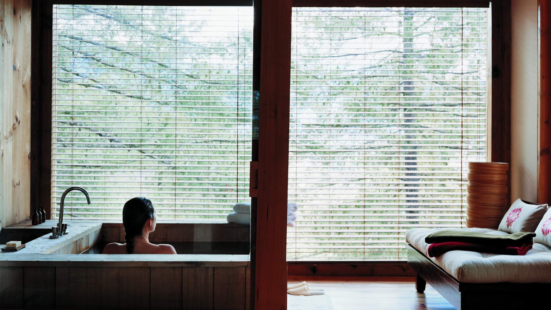 A soaking tub looking out over the valley at a Bhutanese retreat