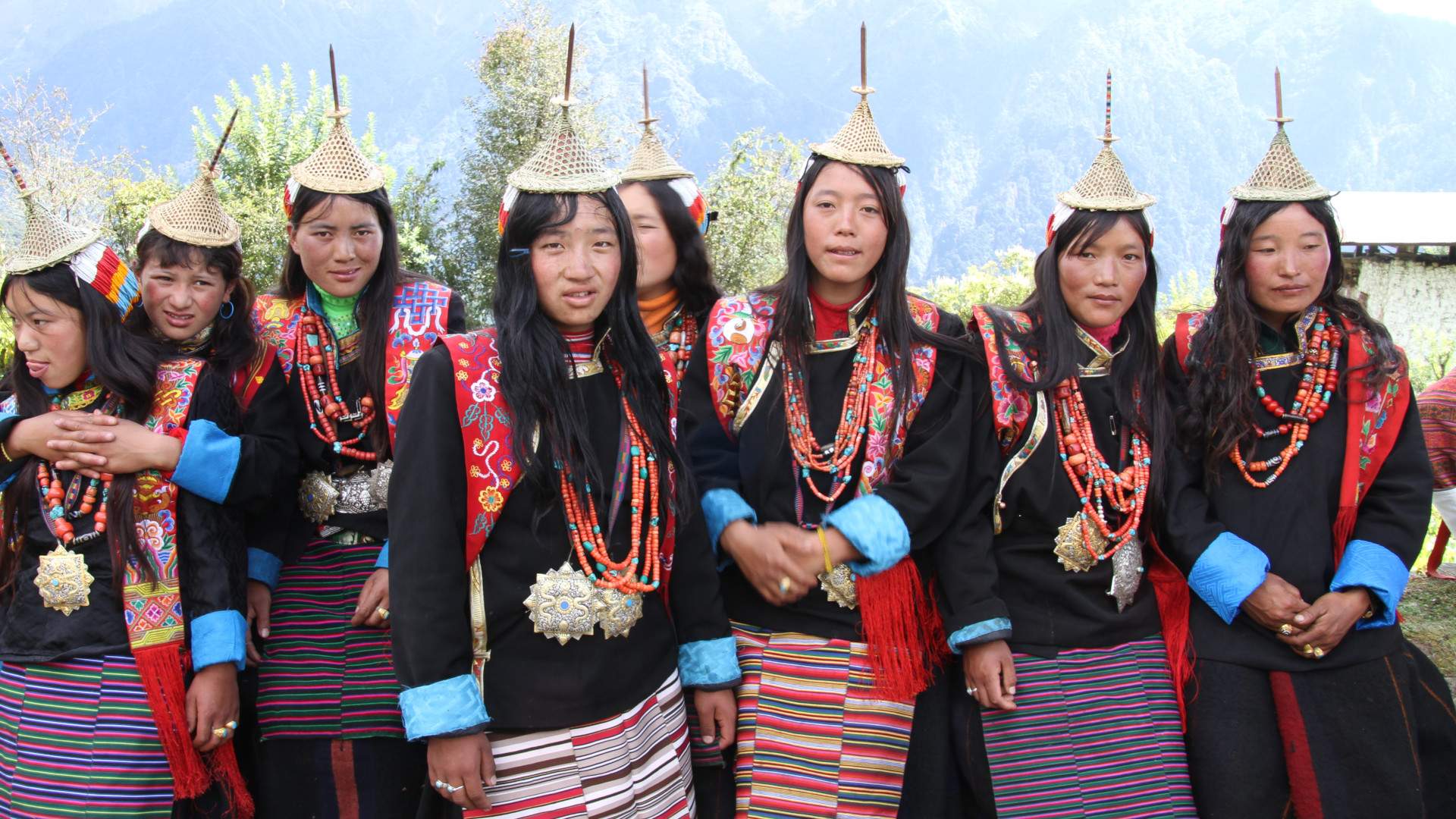 Women of Laya in their conical bamboo hats